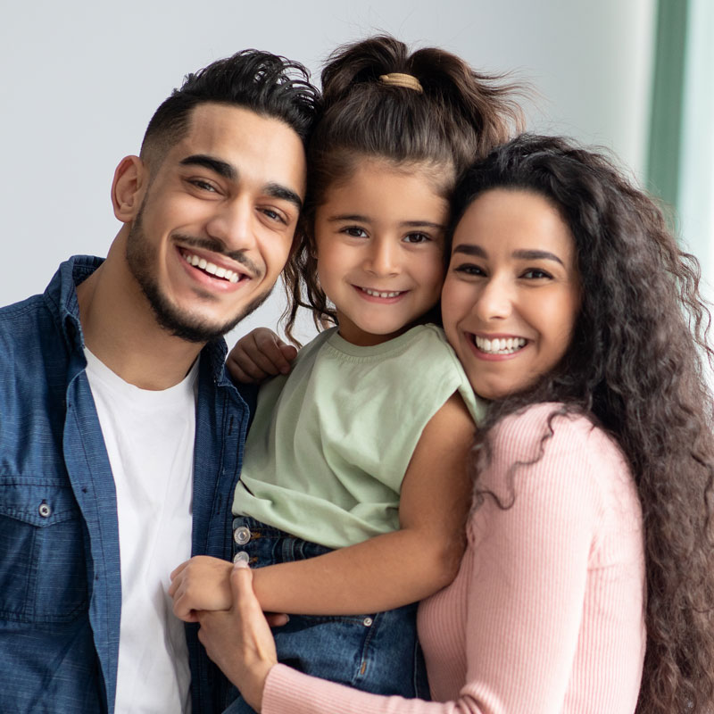 young adult family with daughter smiling